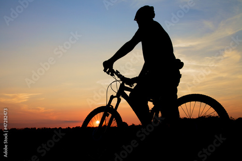 Mountain Biker Silhouette At Sunset