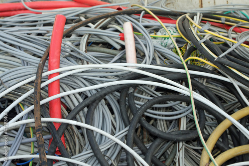 tangle of insulated copper wire in a landfill