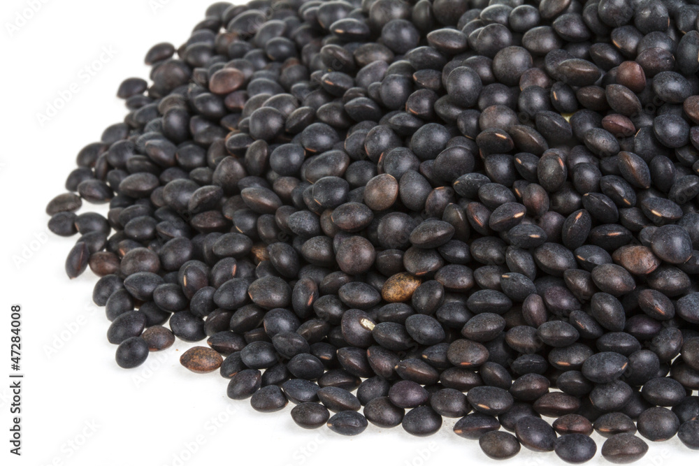 Heap of black lentil isolated on white Heap of black lentil isolated on white