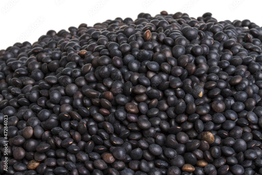 Heap of black lentil isolated on white Heap of black lentil isolated on white