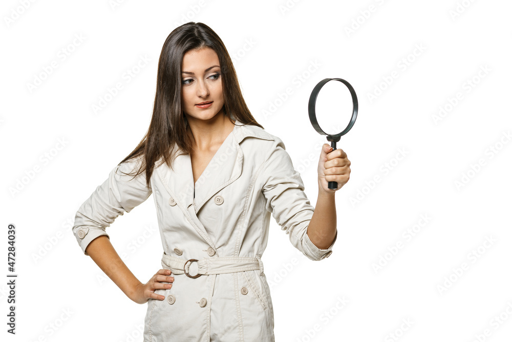 Woman looking through magnifying glass at blank copy space Woman looking through magnifying glass at blank copy space