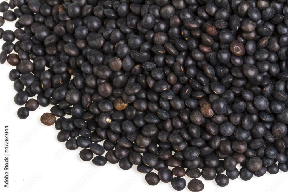 Heap of black lentil isolated on white Heap of black lentil isolated on white