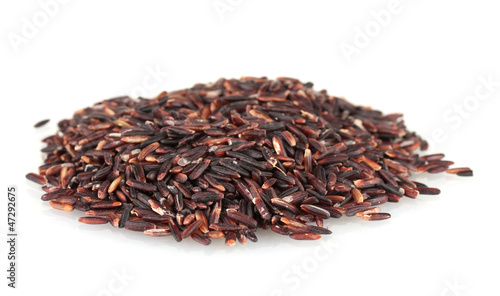 black  rice uncooked in a heap isolated on a white background