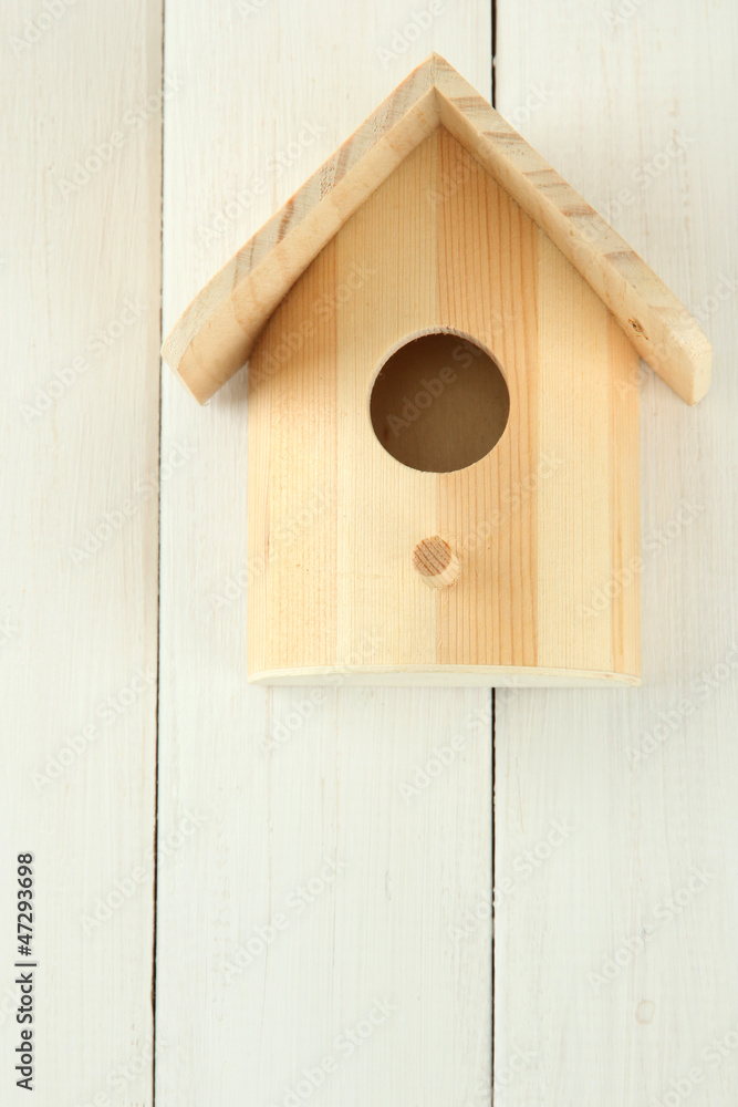 Nesting box on wooden background Nesting box on wooden background