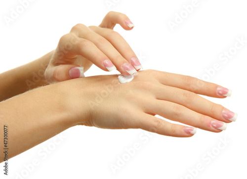 Beautiful woman hands with cream  isolated on white