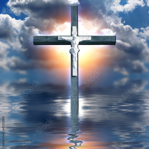 Cross Hangs in Sky over Water