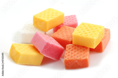 Obraz na plátně fruit caramel candy close-up on white background