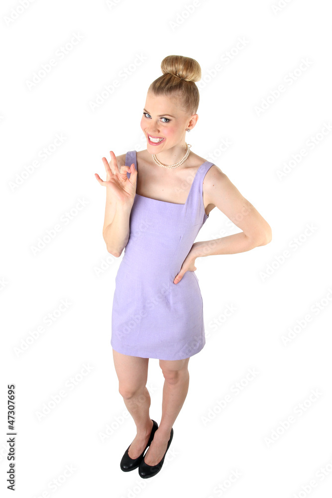 Full length of a happy smiling female with okay gesture. Full length of a happy smiling female with okay gesture.