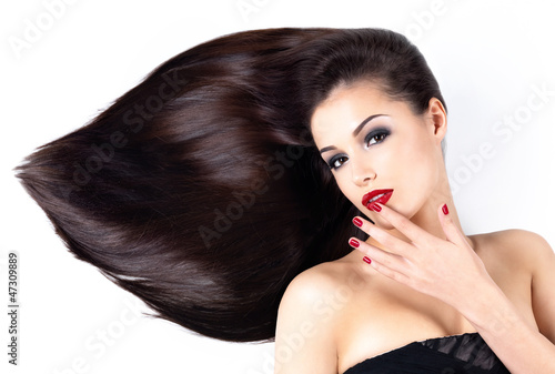 Woman with long straight hairs and elegance nails