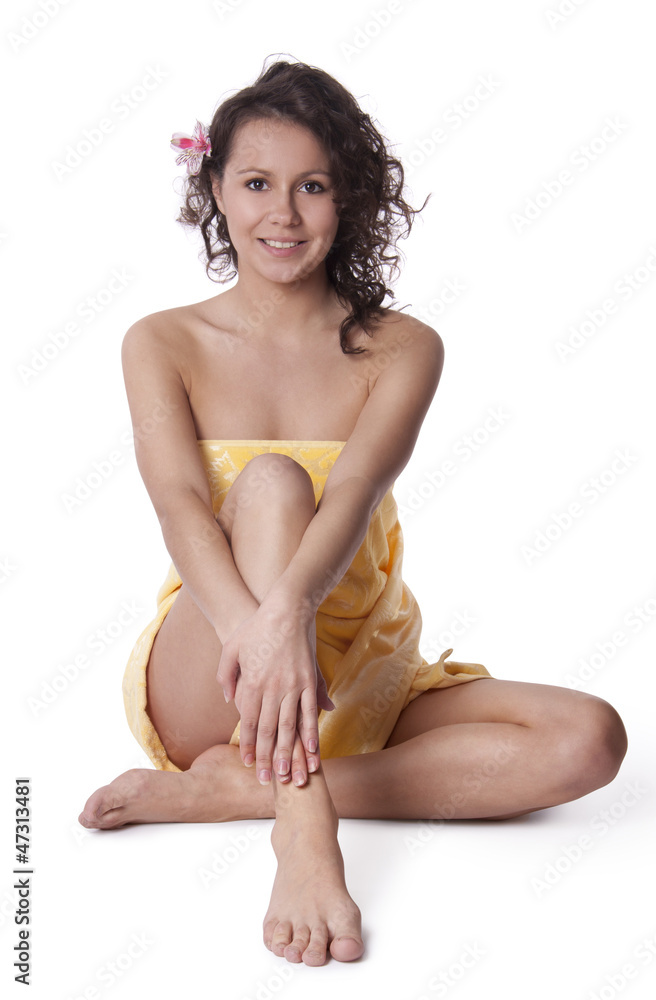 Fototapeta premium Beautiful woman, wrapped a towel sitting