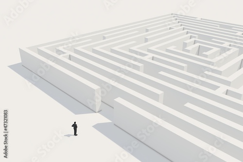 businessman deciding to enter maze
