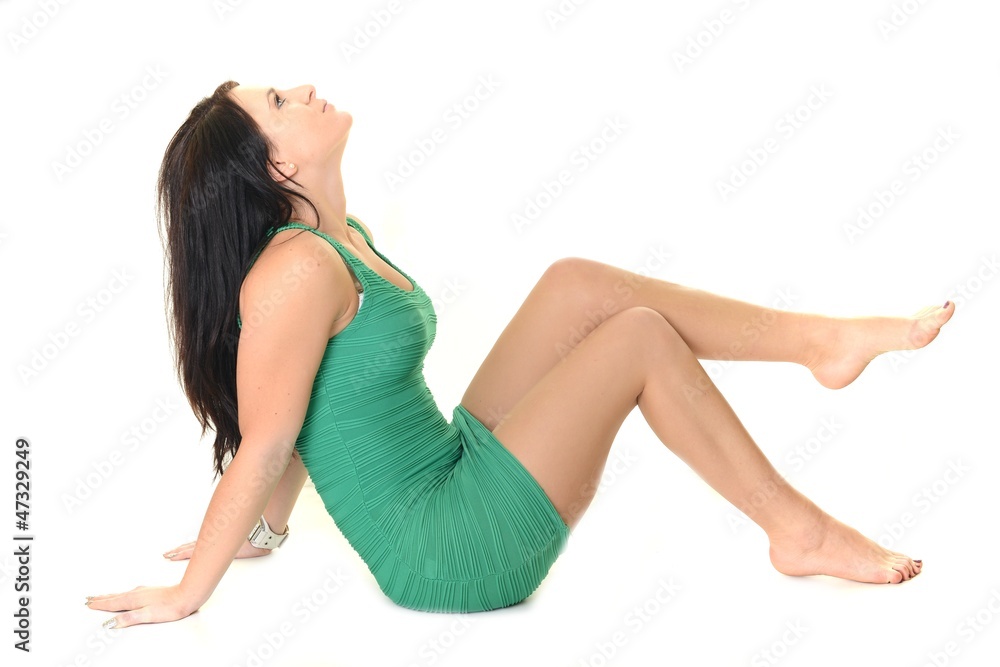 Attractive young girl posing in bright green dress Attractive young girl posing in bright green dress