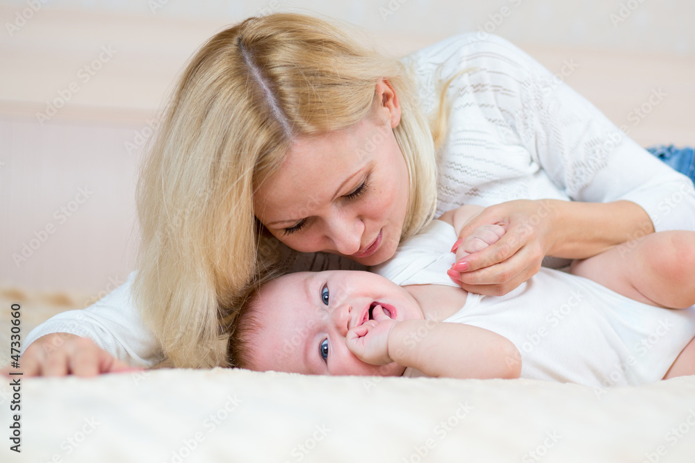 mother playing with baby boy mother playing with baby boy