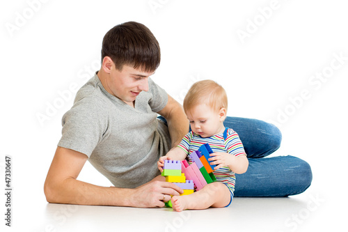 baby boy and father playing...