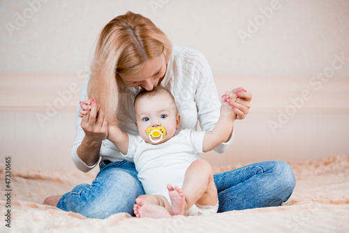 mother playing with baby boy