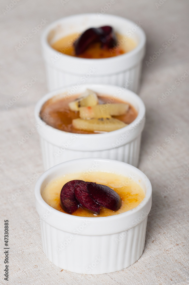 creme brulee with fresh slice fruits on top creme brulee with fresh slice fruits on top