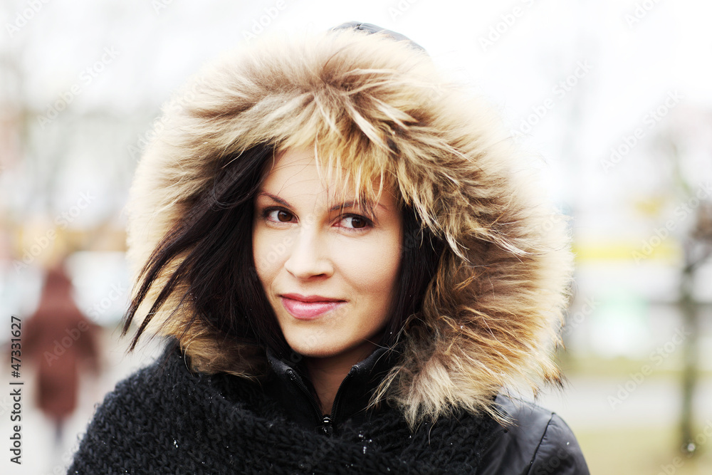 Young woman in furry hood. Young woman in furry hood.