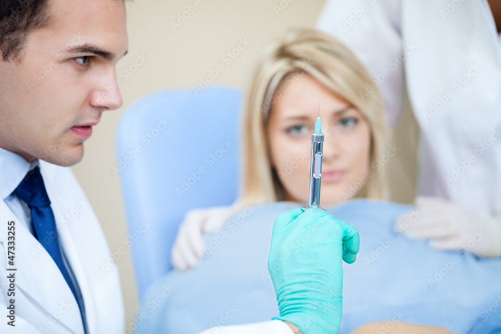 Fototapeta premium Dentist and anesthetize