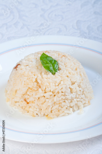 buttery garlic rice with basil leaf