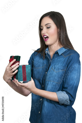 Beautiful woman opening a present photo