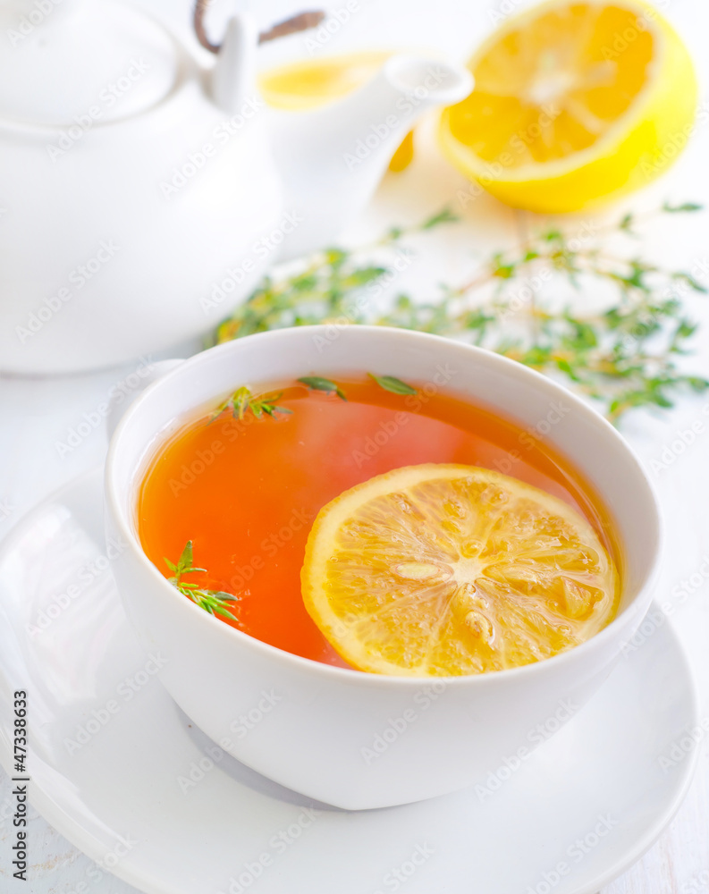 Fresh tea with lemon in the white cup