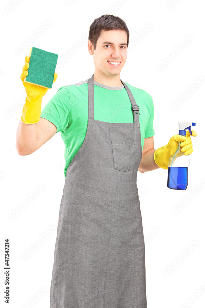 A smiling male cleaner holding cleaning equipment A smiling male cleaner holding cleaning equipment