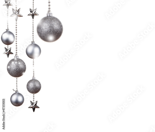 Bright silver Christmas tree balls with curly ribbons isolated.