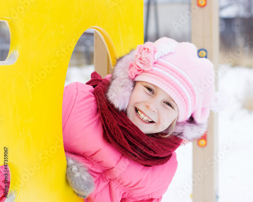 Beautiful happy kid in the red jacket