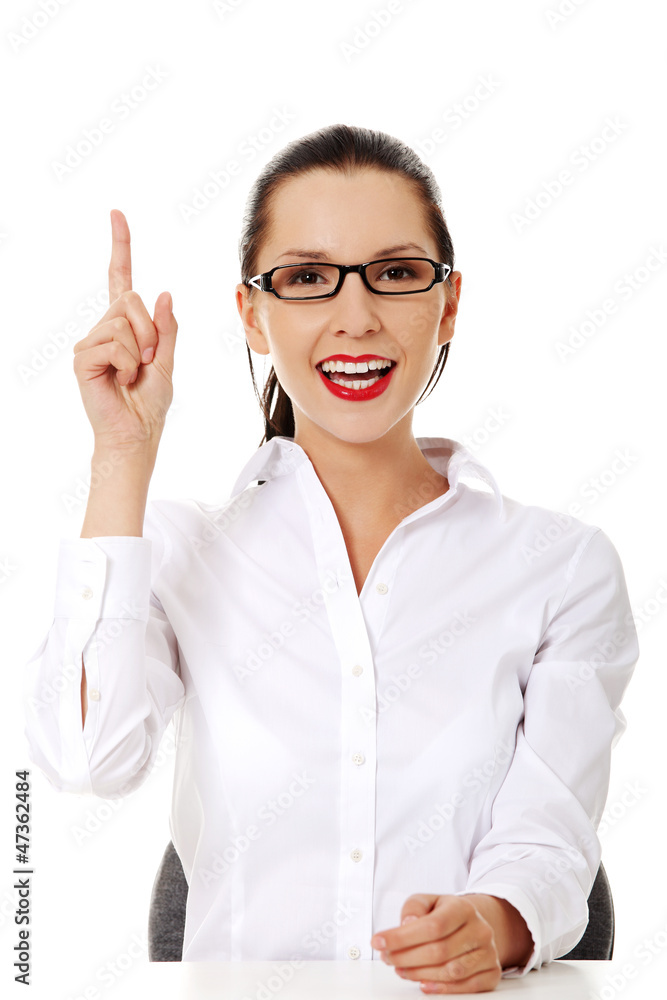 Business woman pointing to empty copy space Business woman pointing to empty copy space
