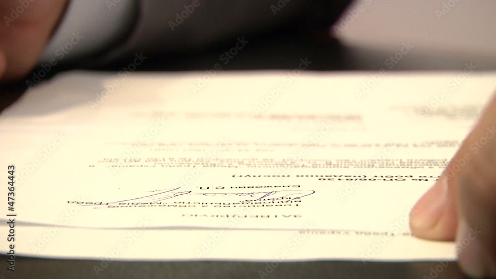 businessman signing on paper