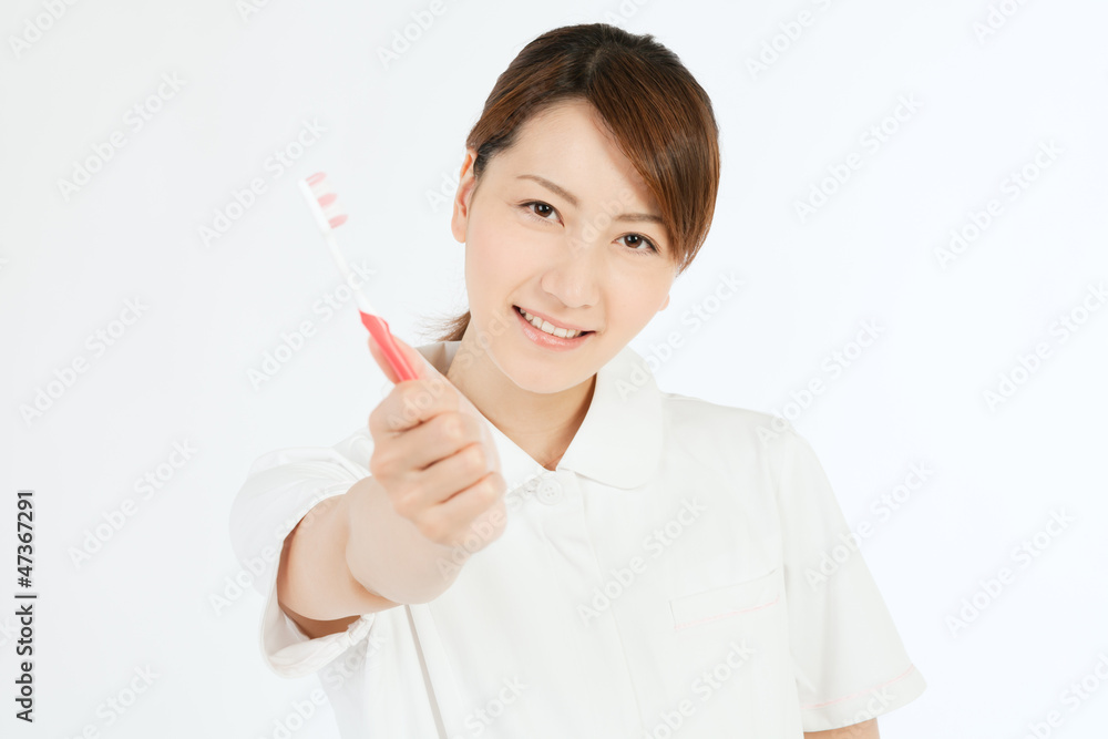 Beautiful young nurse cleaning teeth Beautiful young nurse cleaning teeth