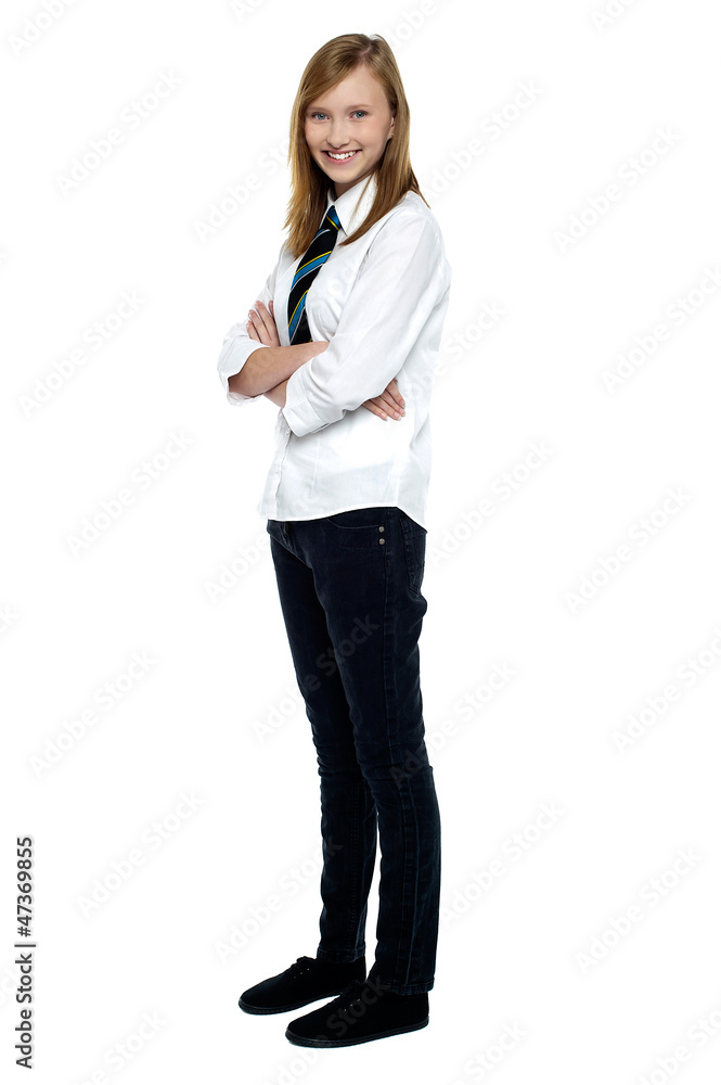 Confident high school girl posing with folded arms Confident high school girl posing with folded arms
