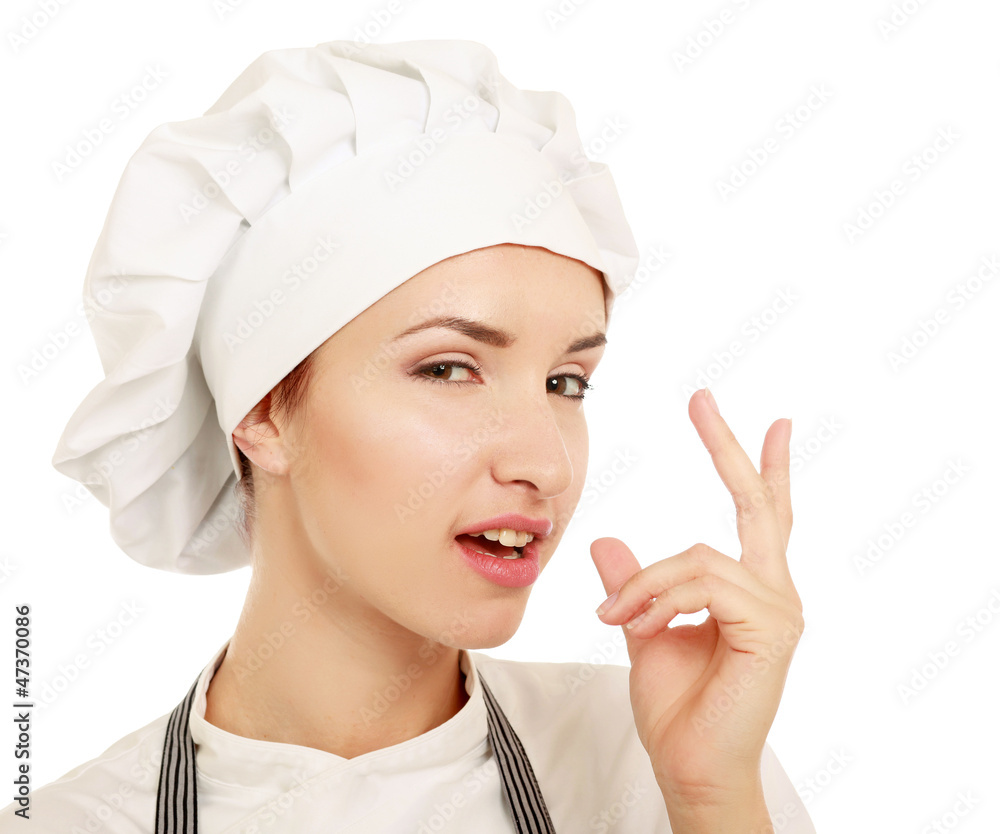 Chef woman in white uniform and hat pointing up