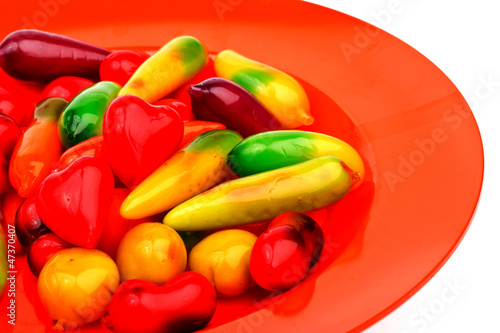 deletable imitation fruits on red plate