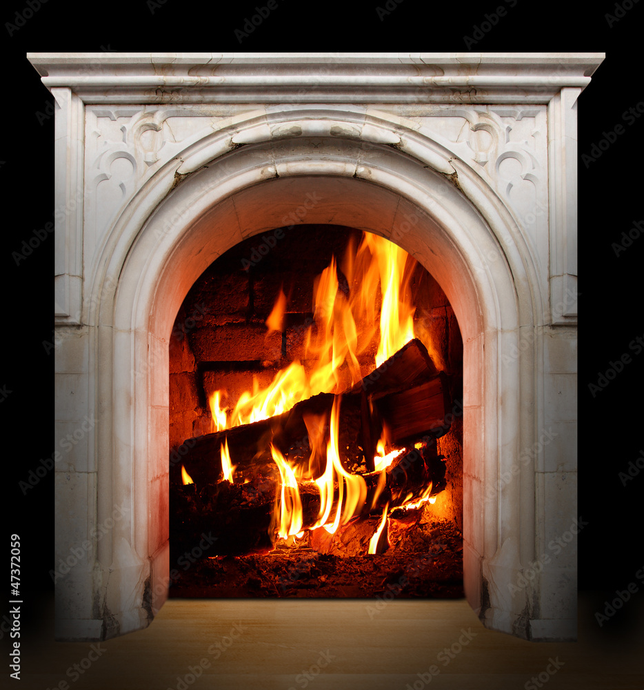 Vintage fireplace with burning logs. Renewable energy concept.
