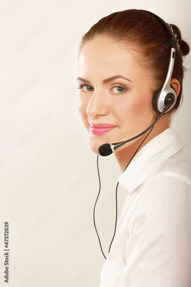 A smiling customer service girl isolated on white background A smiling customer service girl isolated on white background