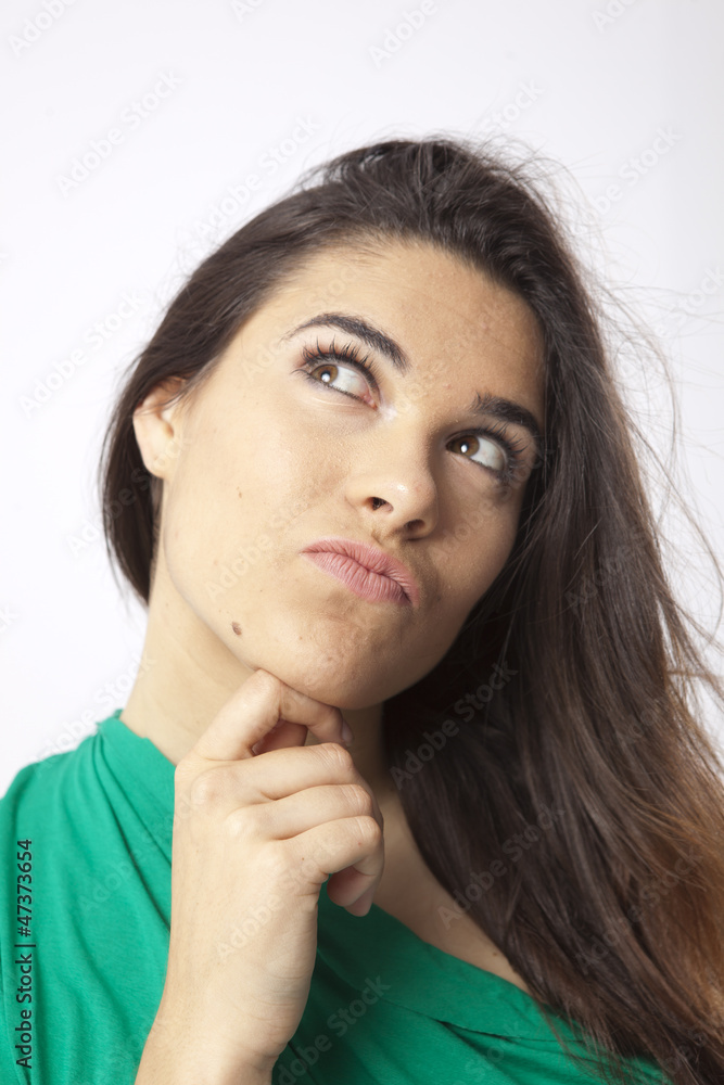 Fototapeta premium real beautiful young girl thinking expression on wihte