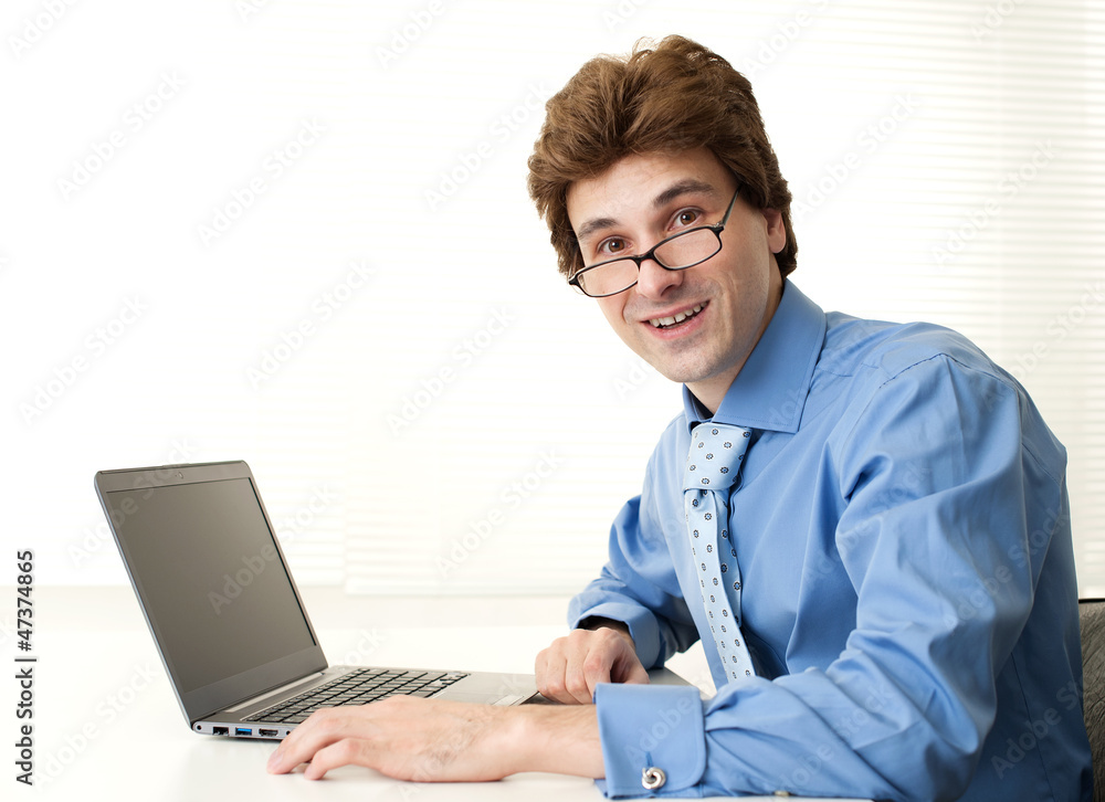 handsome young business man with laptop handsome young business man with laptop