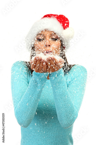 beautiful young woman blowi...