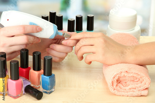 Manicure process in beauty salon  close up