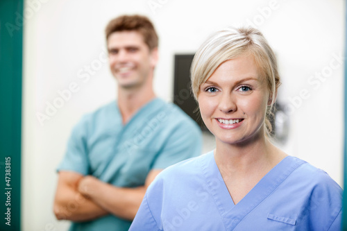 Wallpaper Mural Young Female Vet In Scrubs Smiling Torontodigital.ca