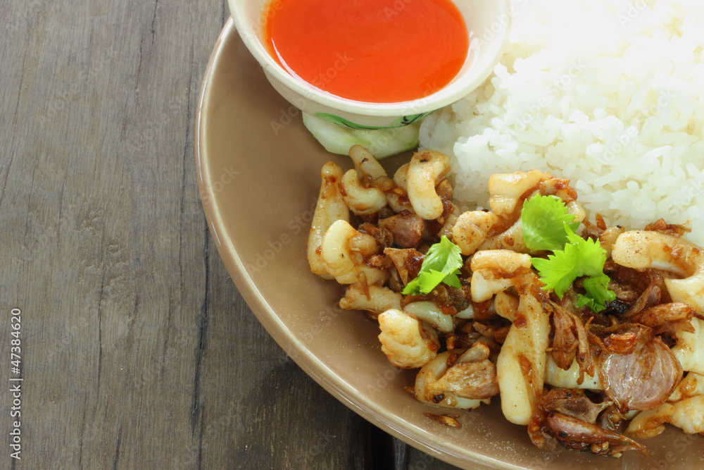 Fried squid with garlic rice with chili sauce Fried squid with garlic rice with chili sauce