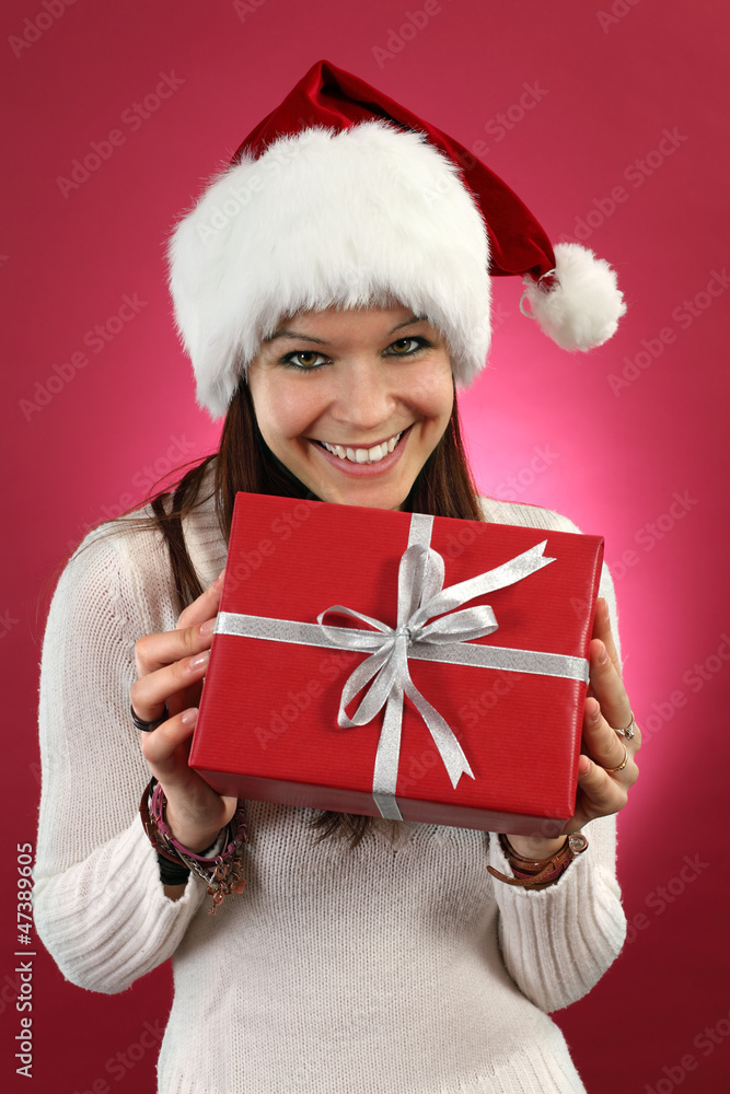 Happy female holding christmas gift Happy female holding christmas gift