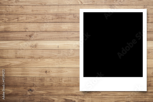 Photo frame on Brown wood plank wall texture background photo