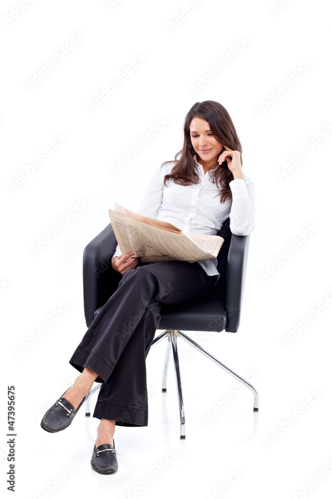Casual 20s woman reading stock rates in newspaper 5 Casual 20s woman reading stock rates in newspaper 5