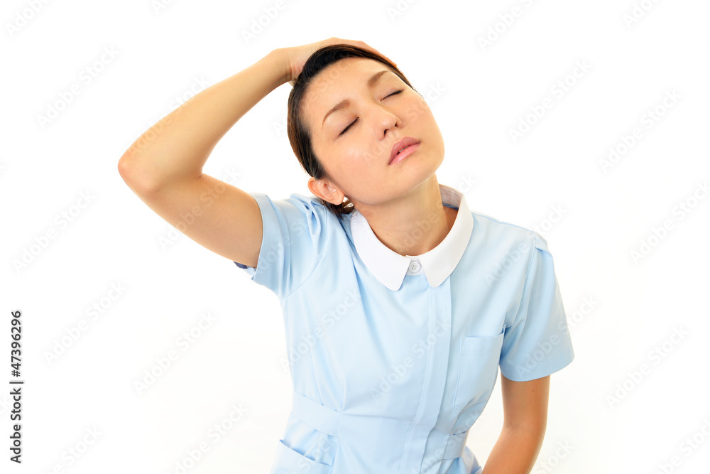 疲れた様子の看護師 疲れた様子の看護師