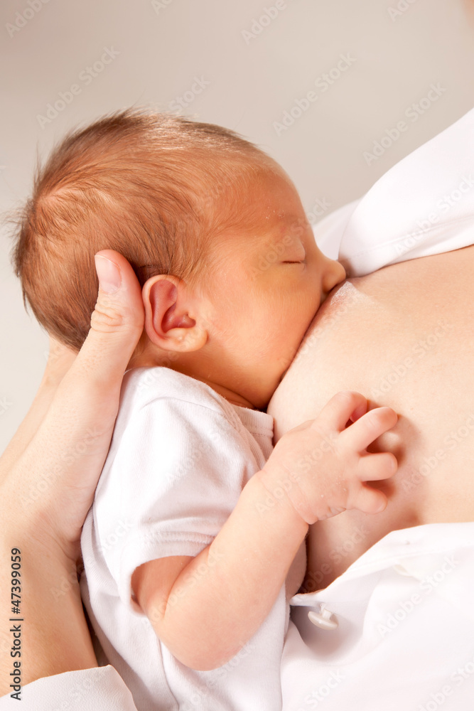 Baby breast feeding close up. The newborn period. Baby breast feeding close up. The newborn period.