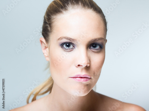 Portrait of beautiful young woman with clean skin