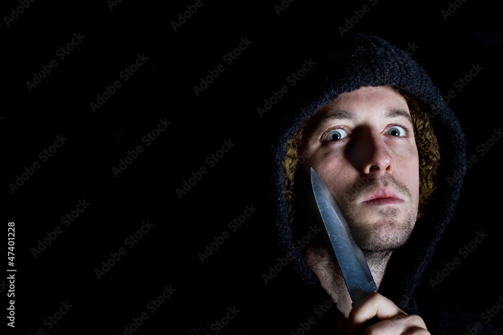 robber with a knife about to mug victim robber with a knife about to mug victim