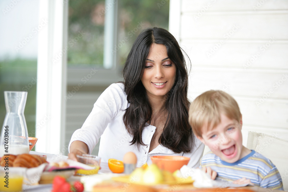 Mother and son at breakfast